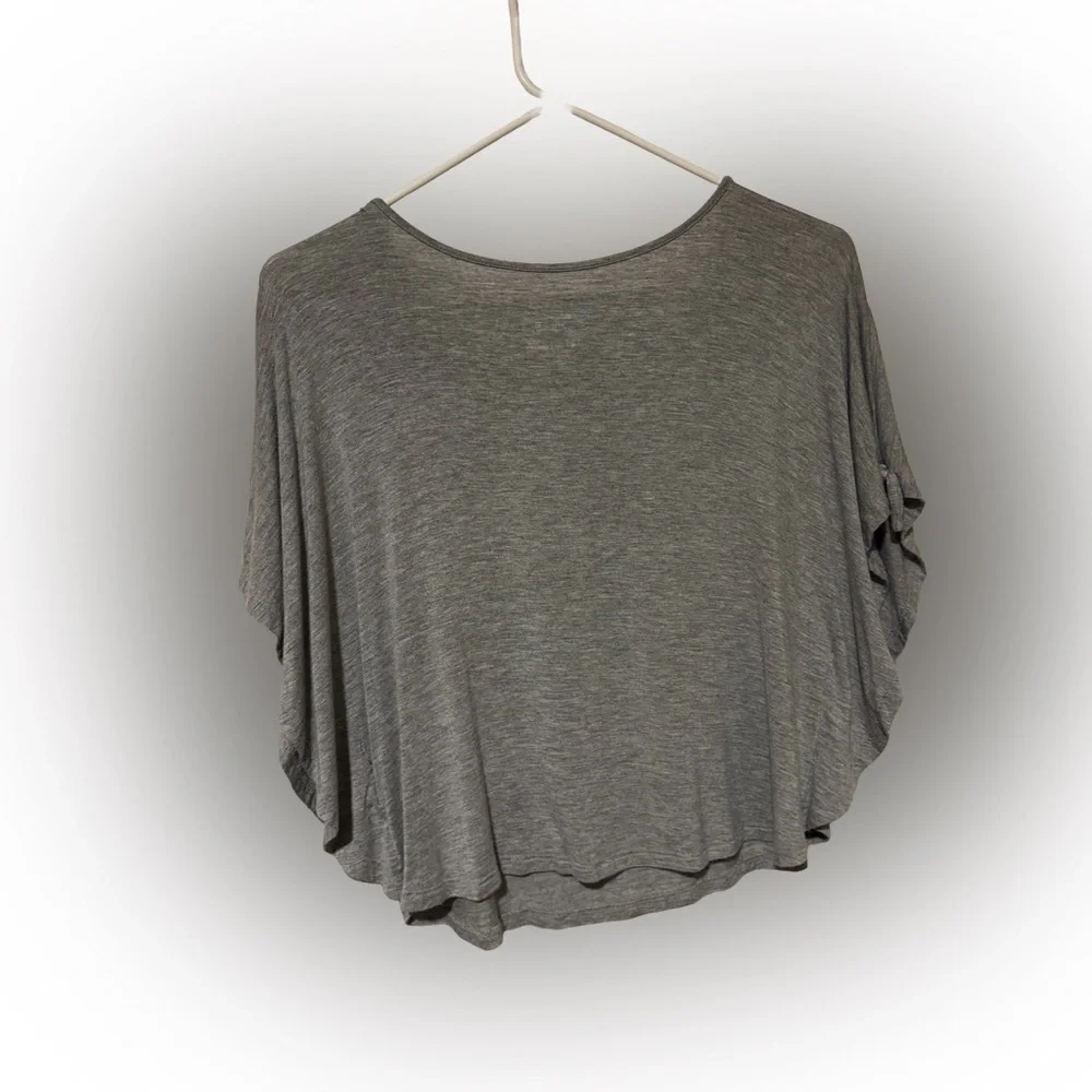 Beautiful Justice top with white decorative detail